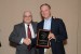 Dr. Nagib Callaos, General Chair, giving Dr. Robert Cherinka a plaque in appreciation for co-presenting a Plenary Keynote Address, titled "Fostering Partnerships between Industry and Academia to promote Science, Technology, Engineering and Mathematics Education."